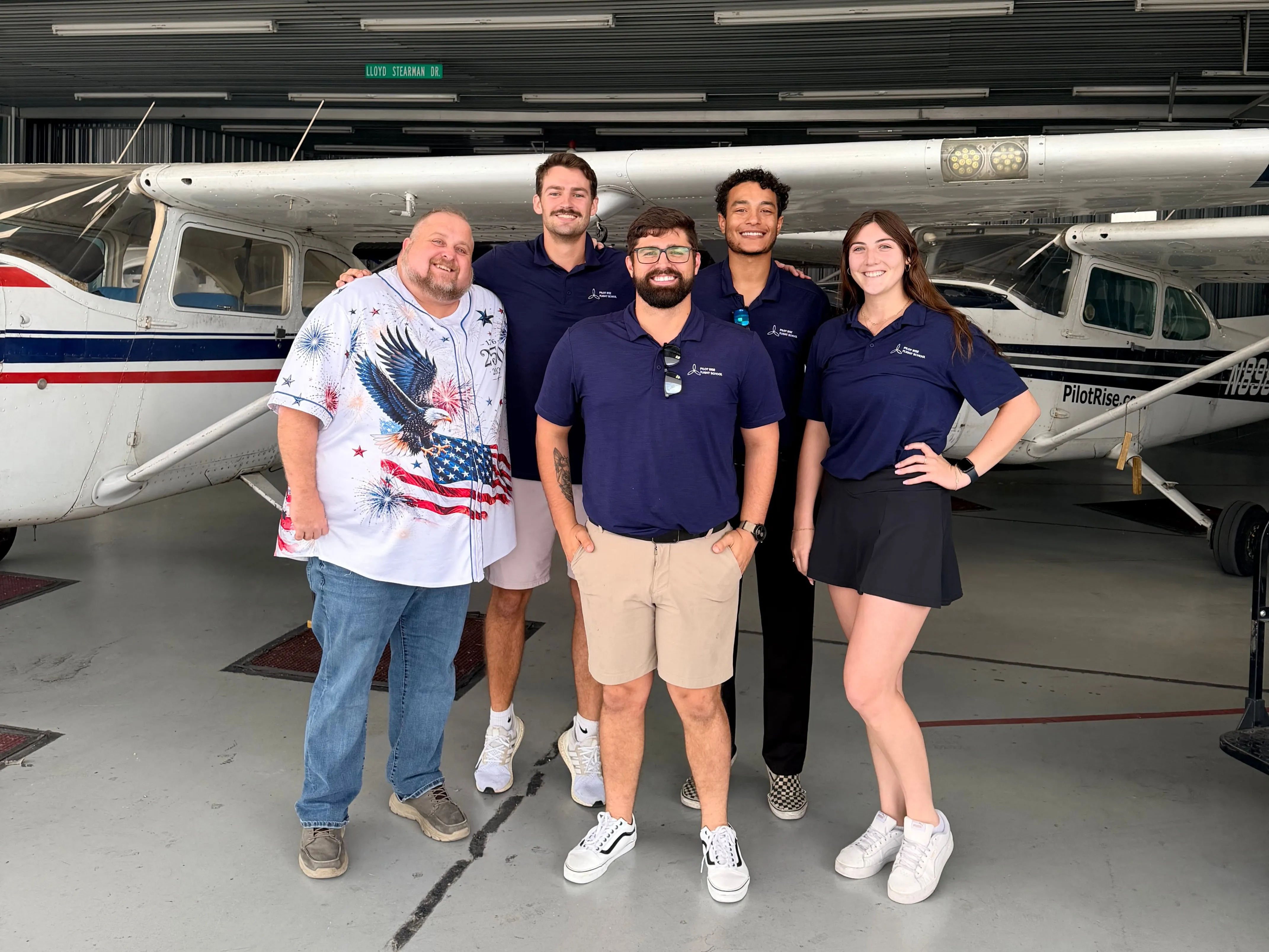 Pilot Rise Dallas flight instructors and team members gathered in front of training aircraft