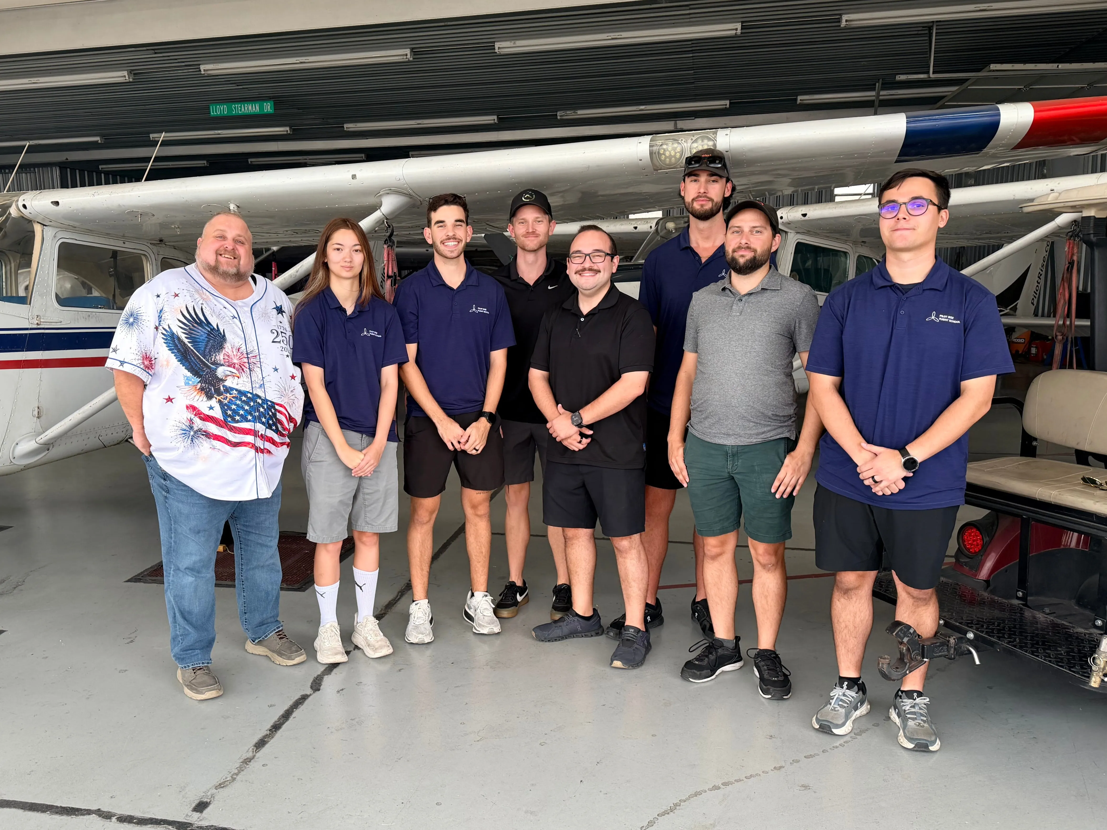 Pilot Rise Fort Worth flight instructors and team members gathered with a training aircraft at Hicks Airfield
