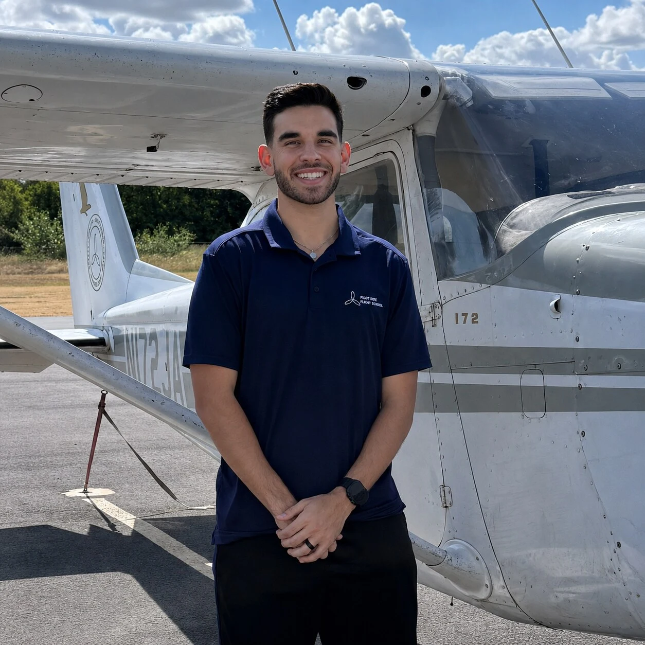 Jaxon Craig, flight instructor at Pilot Rise Fort Worth, standing by a Cessna