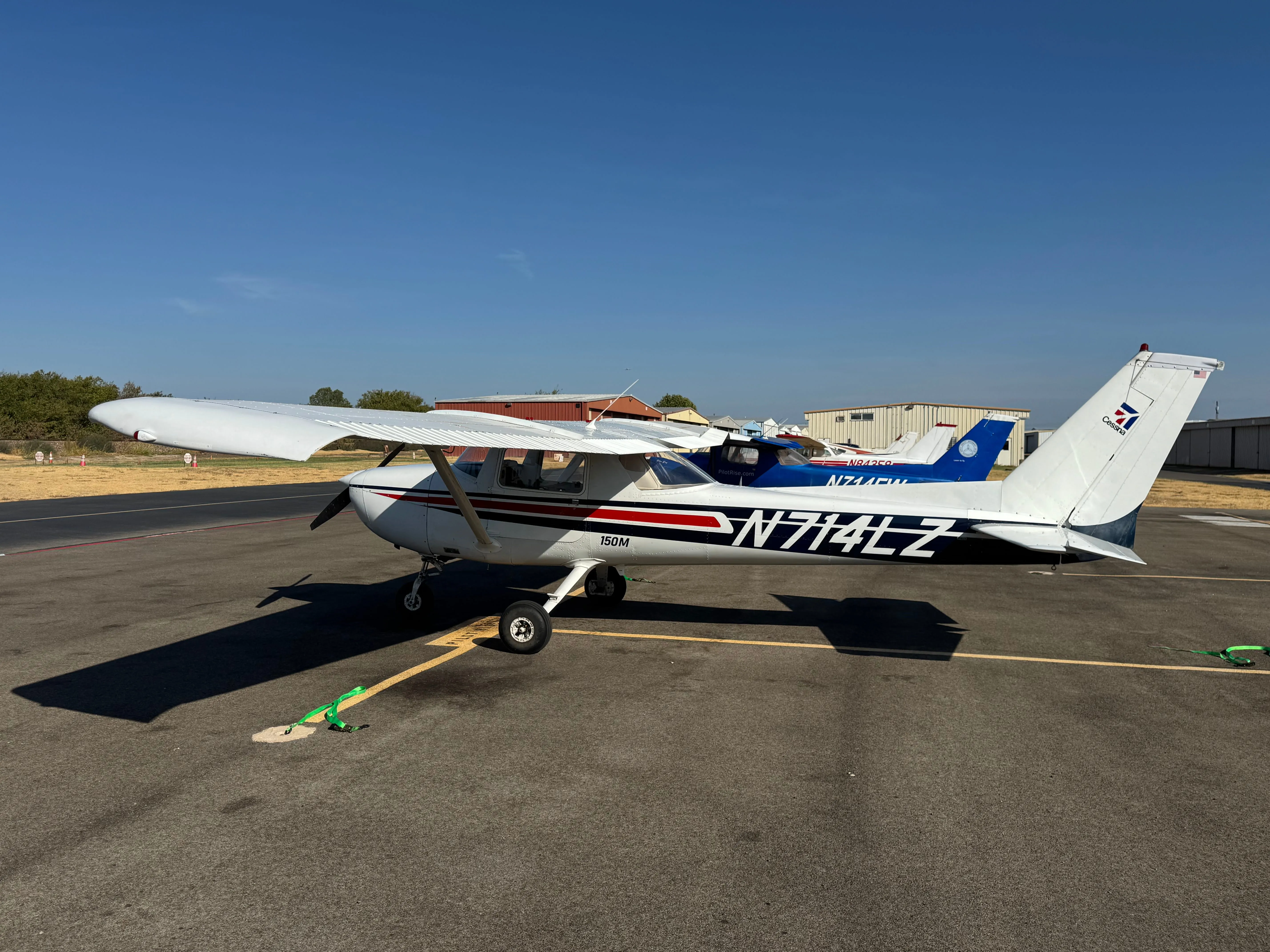 Side exterior view of Pilot Rise Cessna 150M N714LZ Scout