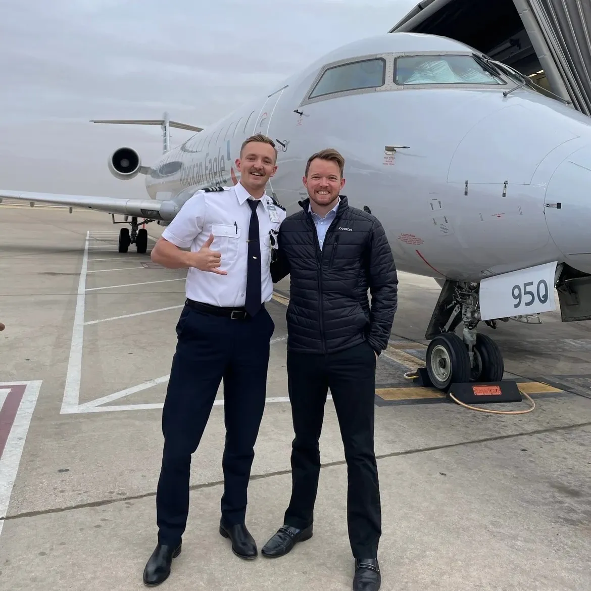 Pilot Rise Articles: Regional airline pilot career: a pilot and aviation professional standing beside an American Eagle regional jet
