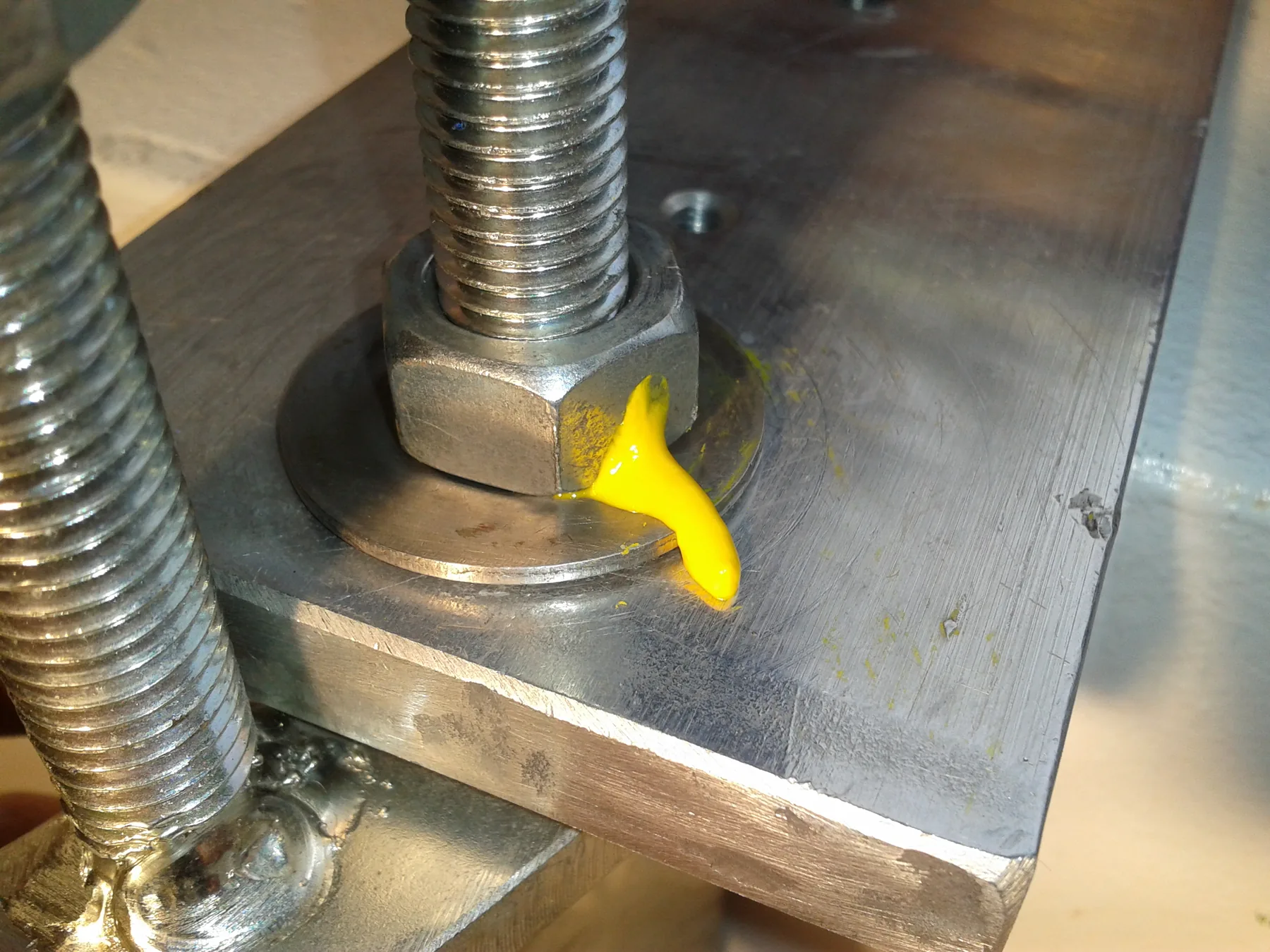 Colored torque seal across a bolt and nut