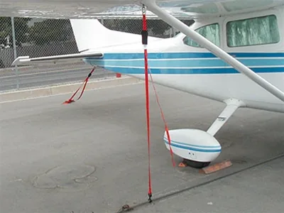 Aircraft tie-down attached to the wing