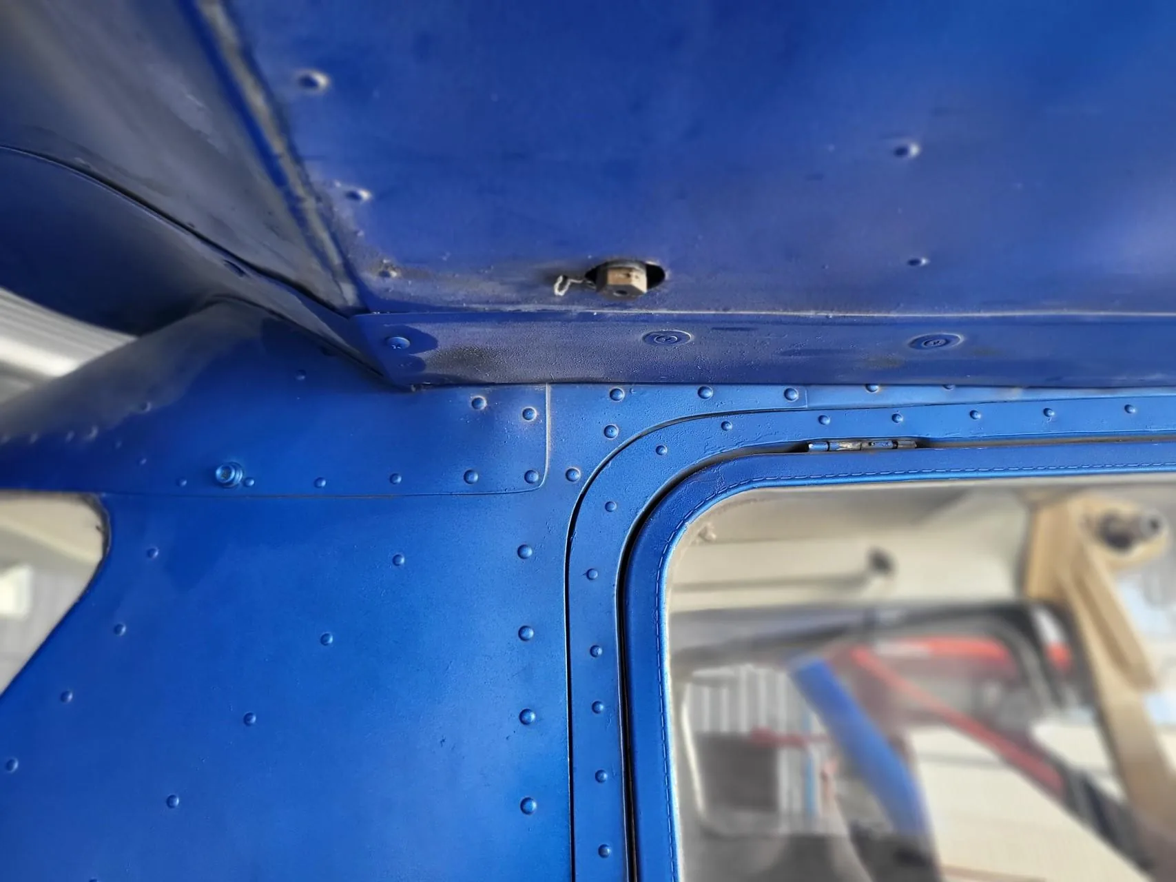 Fuel sump drain beneath a Cessna wing