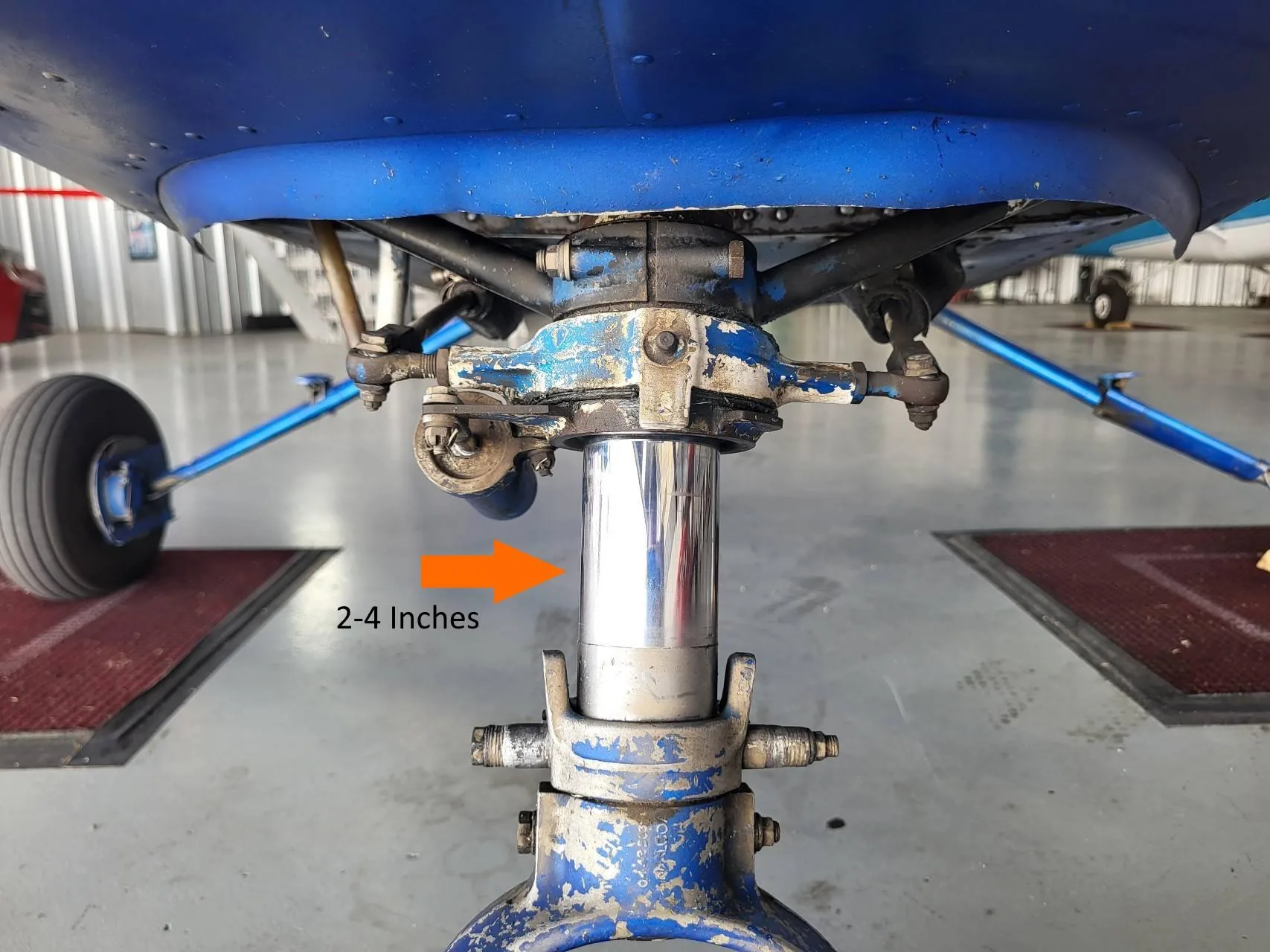 Exposed chrome portion of a nose oleo strut