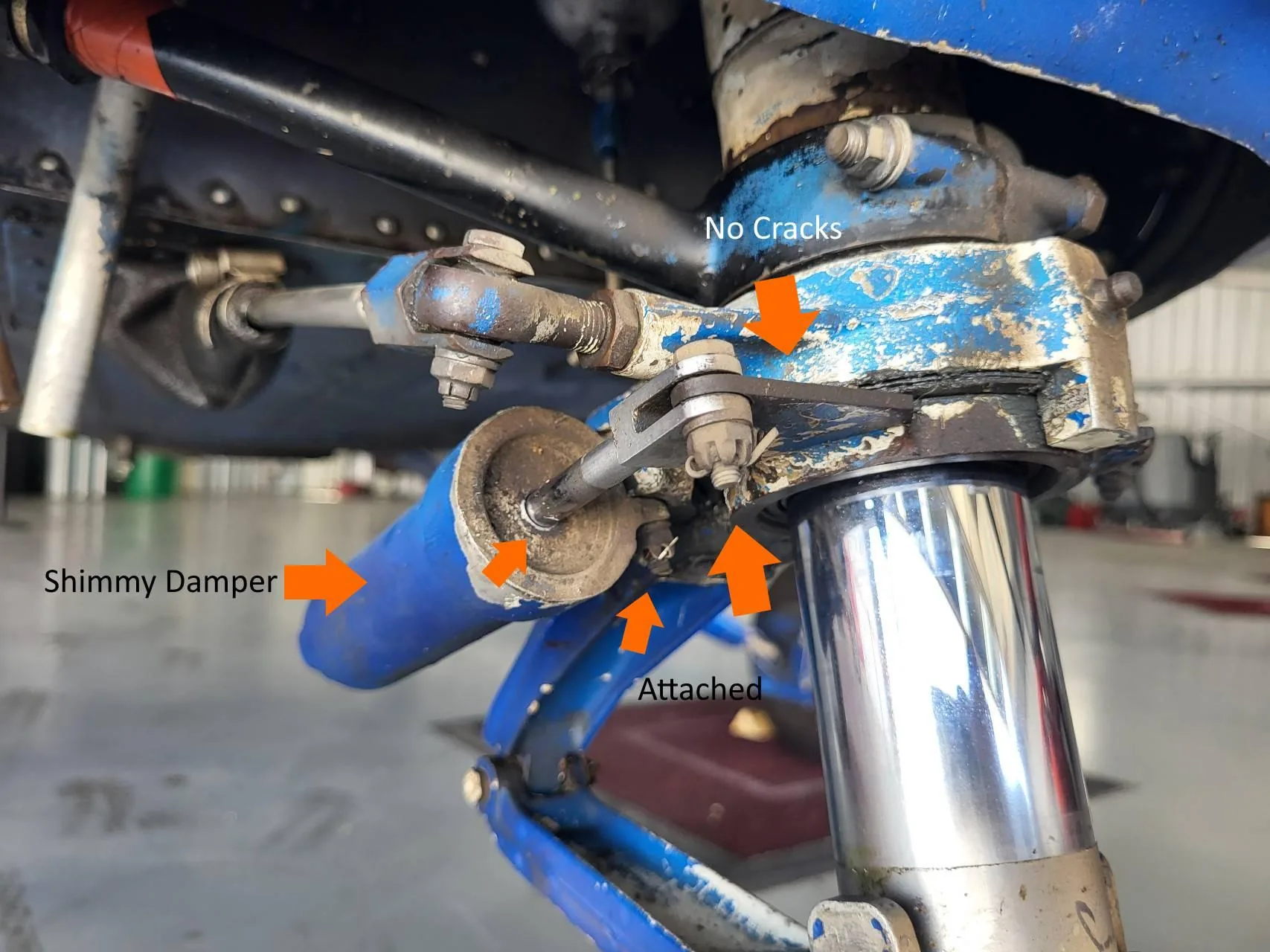 Nose gear shimmy damper